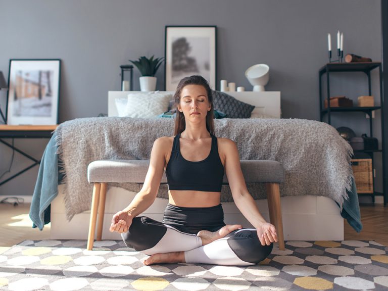 woman doing yoga at home