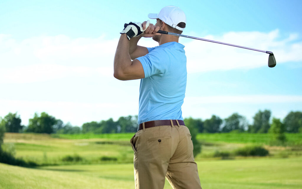 man swing playing golf