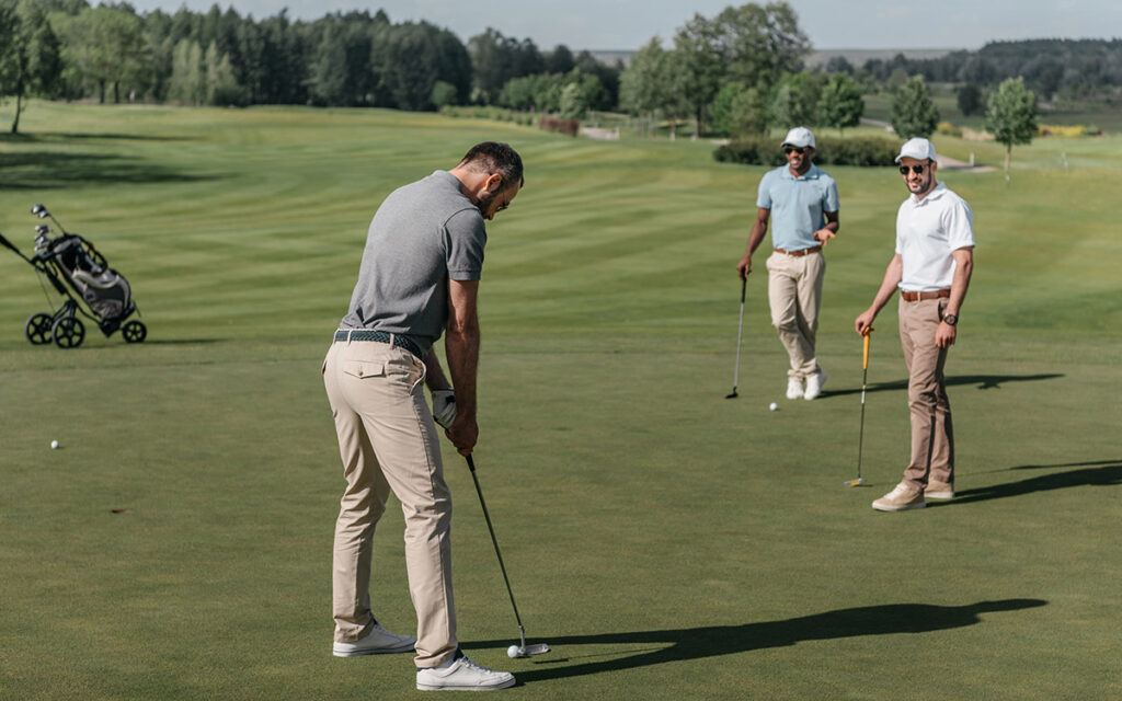 man playing golf in a tournament